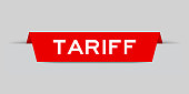 Red color inserted label with word tariff on gray background