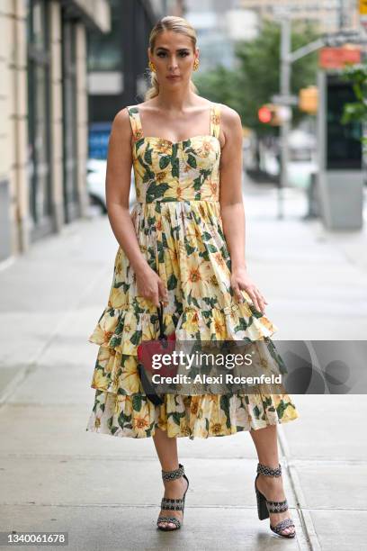 Carmen Carrera is seen wearing a yellow dress by Dolce & Gabbana, Alaya shoes and a YSL bag outside Spring Studios on September 09, 2021 in New York...