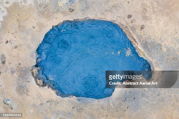 drone image showing a blue hot spring in hverir geothermal area, iceland - acid stock pictures, royalty-free photos & images