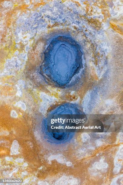 two circular geothermal hot springs photographed from above, hverir, iceland - nah stock-fotos und bilder