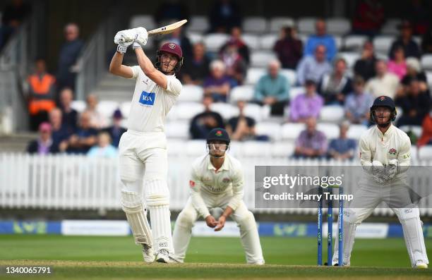 Tom Lammonby of Somerset plays a shot as Alex Davies of Lancashire looks on during Day Two of the LV= Insurance County Championship match between...