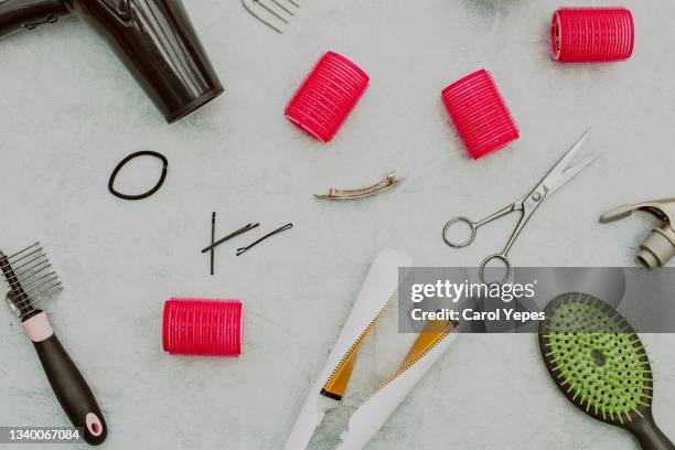 various hair styling devices on white background, top view - hair curlers stock pictures, royalty-free photos & images