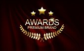 Golden award sign with laurel wreath and podium isolated on red curtain background.