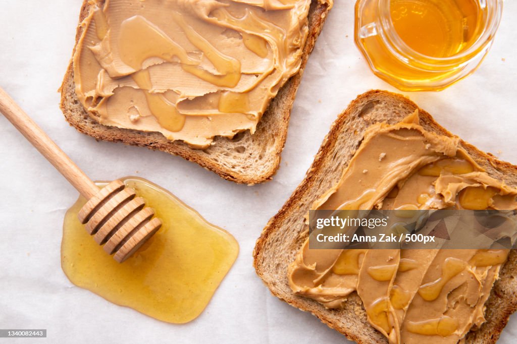 High angle view of honey with peanut butter on table