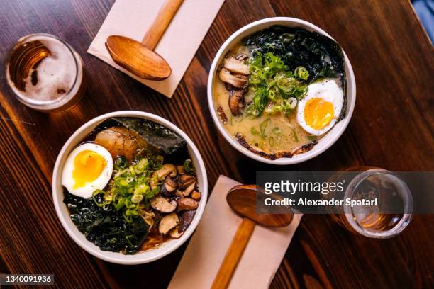 ramen soup served at the restaurant, directly above view - ramen noodles stock pictures, royalty-free photos & images