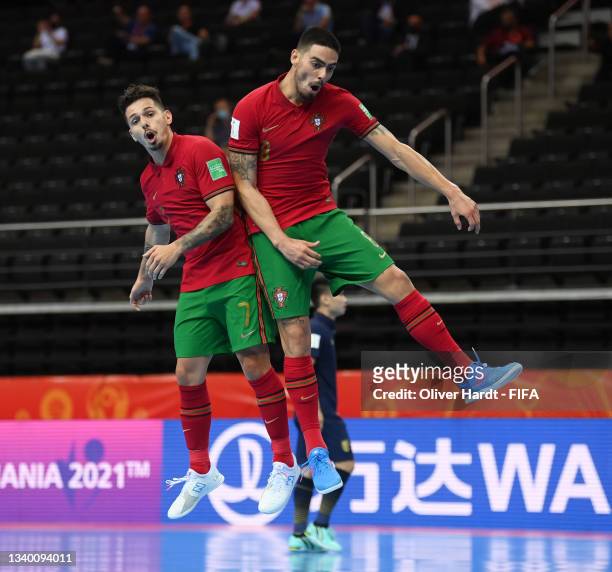 Erick of Portugal celebrates with teammate Bruno Coelho after scoring their team's second goal during the FIFA Futsal World Cup 2021 group C match...
