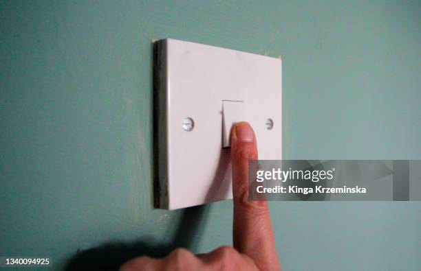 light switch - turning on or off stock-fotos und bilder