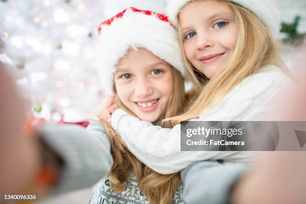 sisters christmas day selfie - sibling christmas stock pictures, royalty-free photos & images