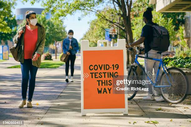 covid testing center sign - sidewalk sign stock pictures, royalty-free photos & images