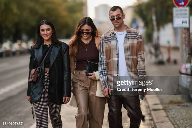 Katharina Damm, Annamaria Damm and Jannik Stutzenberger arriving at About You Fashion Week on September 11, 2021 in Berlin, Germany.