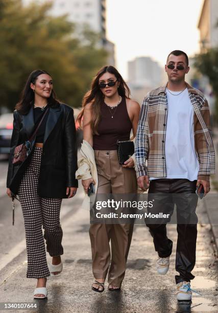 Katharina Damm, Annamaria Damm and Jannik Stutzenberger arriving at About You Fashion Week on September 11, 2021 in Berlin, Germany.