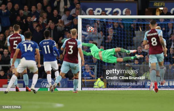 Andros Townsend of Everton scores their team's second goal as Nick Pope of Burnley dives in vain during the Premier League match between Everton and...