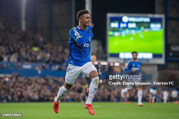 Demarai Gray of Everton celebrates scoring his teams third goal during the Premier League match between Everton and Burnley at Goodison Park on...