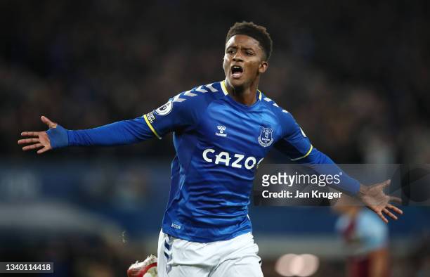 Demarai Gray of Everton celebrates after scoring their team's third goal during the Premier League match between Everton and Burnley at Goodison Park...