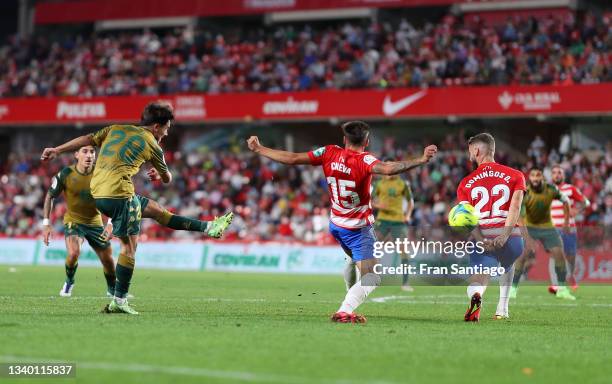 Rodri of Real Betis scores their team's first goal during the LaLiga Santander match between Granada CF and Real Betis at Nuevo Estadio de Los...