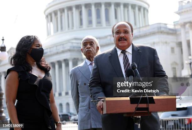 Cilvil rights leader Martin Luther King III speaks alongside Andrea Waters King and Rev. Al Sharpton at a press conference on voting rights outside...