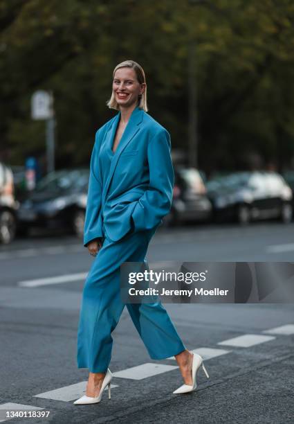 Karolina Kurkova wearing a blue two piece and white heels on September 11, 2021 in Berlin, Germany.