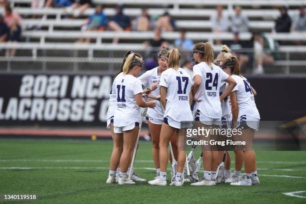 The Northwestern Wildcats huddle against the Syracuse Orange during the Division I Women’s Lacrosse Semifinals held at Johnny Unitas Stadium on May...
