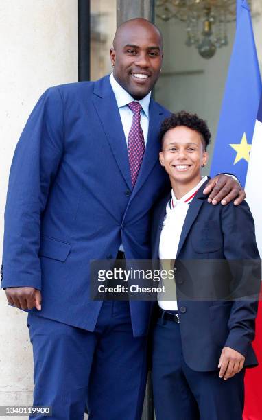 French judoka Teddy Riner and his son Eden pose as they arrive at the Elysee Presidential Palace prior to a ceremony in honor of the Olympic and...