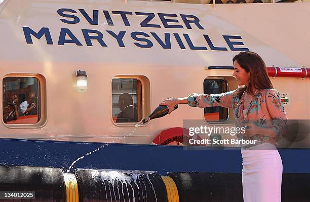 Princess Mary of Denmark sprays champagne as she christens the tugboat 'Svitzer Marysville' during the naming ceremony on November 24, 2011 in...