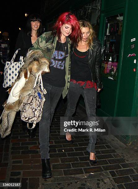 Kate Moss and Alison Mosshart leeaving the Groucho club on November 23, 2011 in London, England.