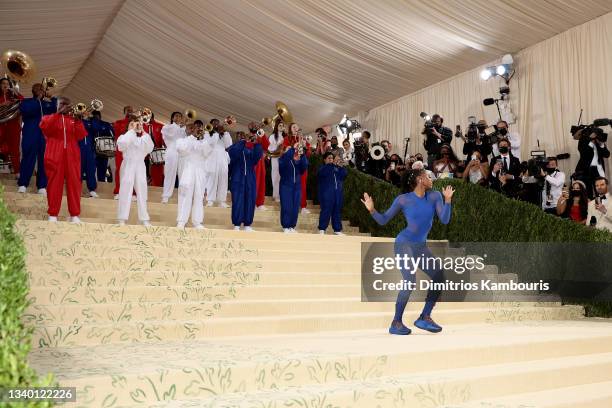 Gymnast Nia Dennis and the Brooklyn United Marching Band attend The 2021 Met Gala Celebrating In America: A Lexicon Of Fashion at Metropolitan Museum...