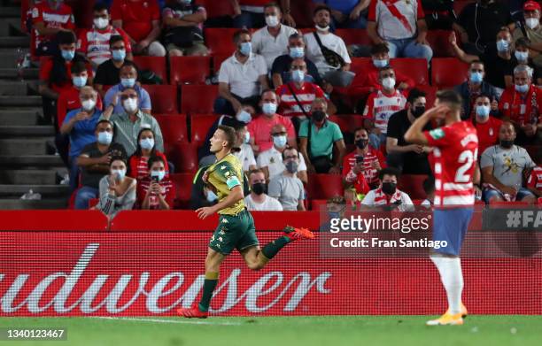 Sergio Canales of Real Betis celebrates after scoring their team's second goal during the LaLiga Santander match between Granada CF and Real Betis at...