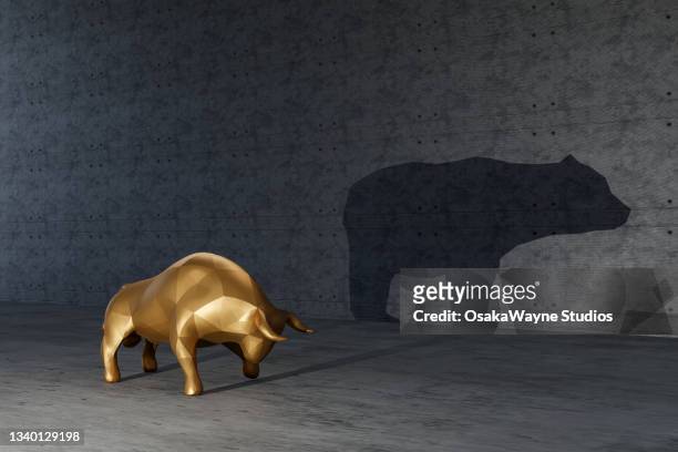 bull making shadow of bear on wall - bear market 個照片及圖片檔