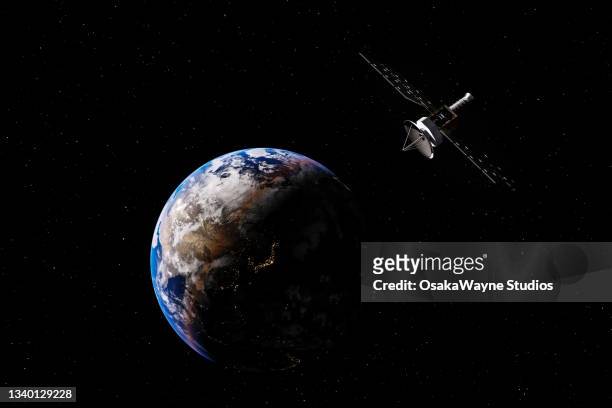 artificial space object on earth orbit - orbiting foto e immagini stock