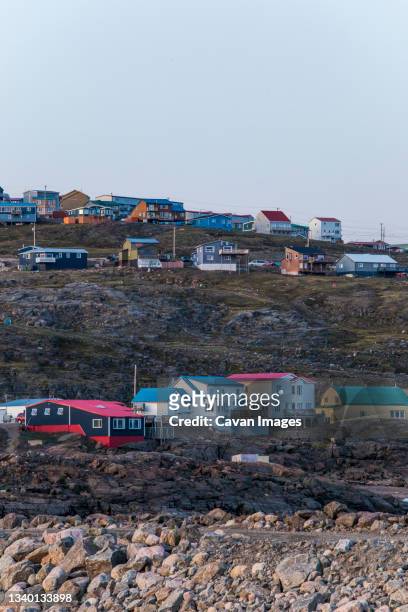 rows of houses, city of iqaluit, canada. - iqaluit stock pictures, royalty-free photos & images