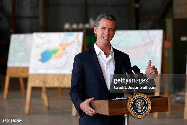 California Gov. Gavin Newsom delivers remarks to reporters after a helicopter tour with U.S. President Joe Biden of the Caldor Fire area, at Mather...