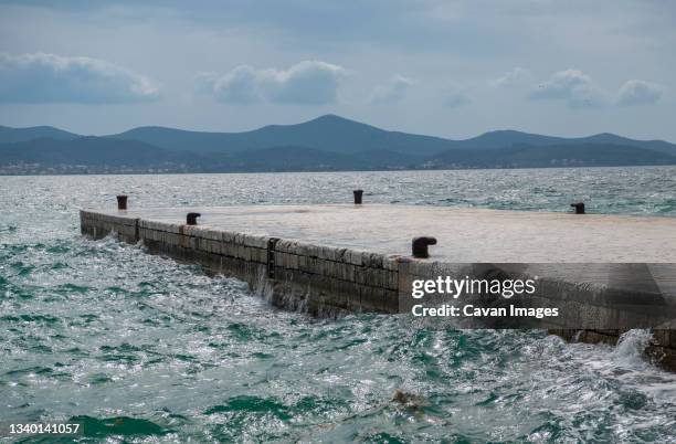 empty pier on the dalmatian coast - zadar croatia stock pictures, royalty-free photos & images