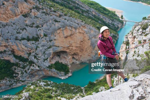 woman rapelling into the verdon canyon - gorges du verdon fotografías e imágenes de stock