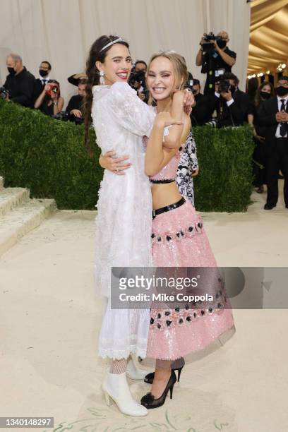 Margaret Qualley and Lily-Rose Depp attend The 2021 Met Gala Celebrating In America: A Lexicon Of Fashion at Metropolitan Museum of Art on September...