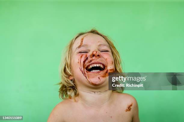 laughing chocolate face - chocolate face stock pictures, royalty-free photos & images