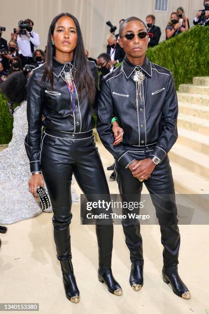 Helen Lasichanh and Pharrell Williams attend The 2021 Met Gala Celebrating In America: A Lexicon Of Fashion at Metropolitan Museum of Art on...