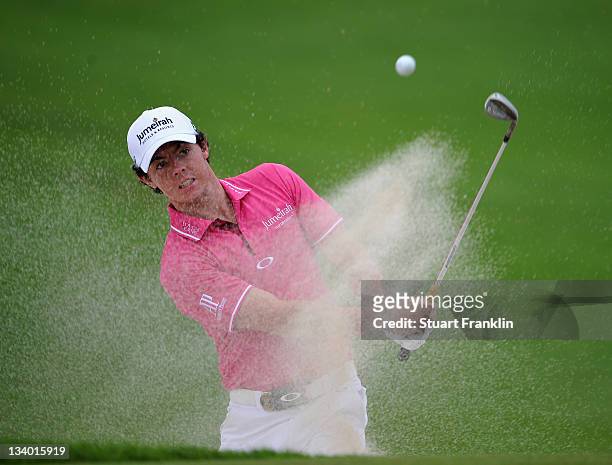 Rory McIlroy of Ireland plays a bunker shot during the first days fourballs at the Omega Mission Hills World Cup at the Mission Hills' Blackstone...
