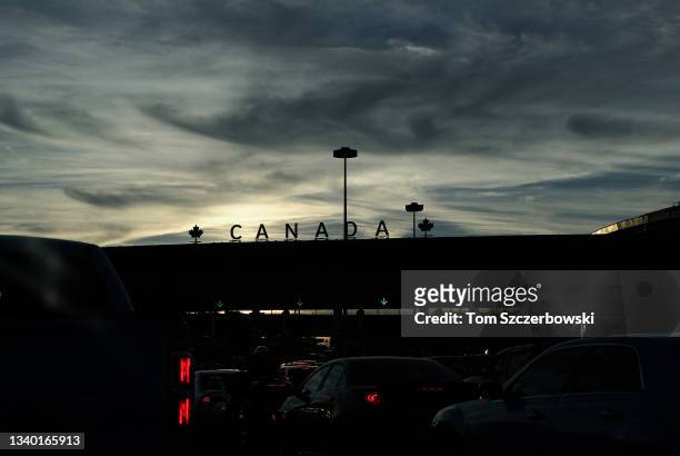Cars line up at the Canadian border with the United States after getting off the Peace Bridge on September 8, 2013 in Buffalo, New York. Ahead are...
