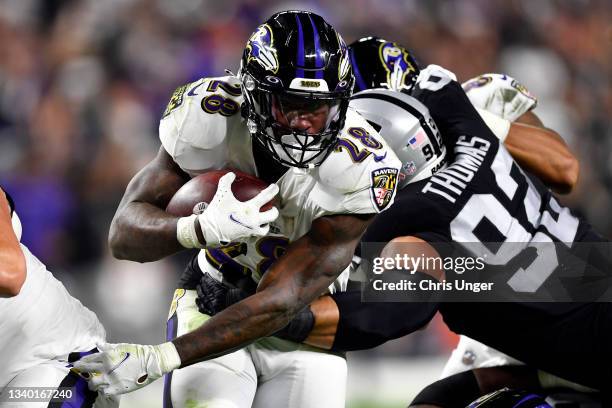 Latavius Murray of the Baltimore Ravens runs for a touchdown in the fourth quarter against the Las Vegas Raiders at Allegiant Stadium on September...