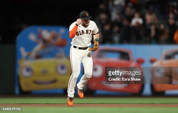 Evan Longoria of the San Francisco Giants celebrates after the Giants beat the San Diego Padres to clinch a playoff birth at Oracle Park on September...