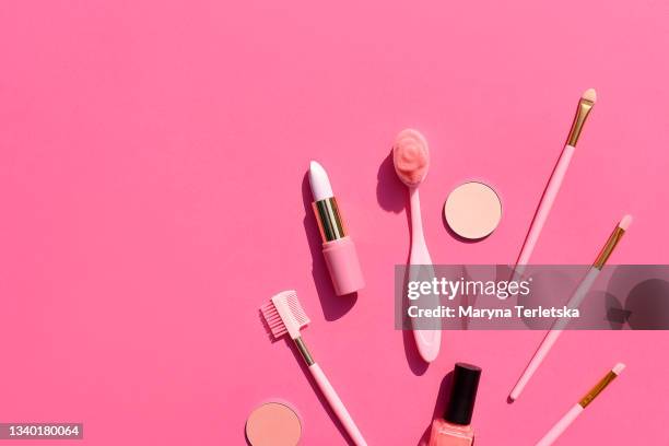 decorative cosmetics and brushes on a pink background. - foundation make up stock pictures, royalty-free photos & images