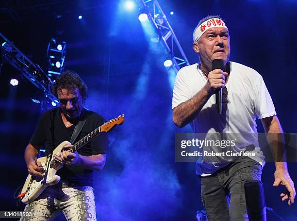 Ian Moss and Jimmy Barnes of Cold Chisel perform on stage at Rod Laver Arena on November 24, 2011 in Melbourne, Australia.