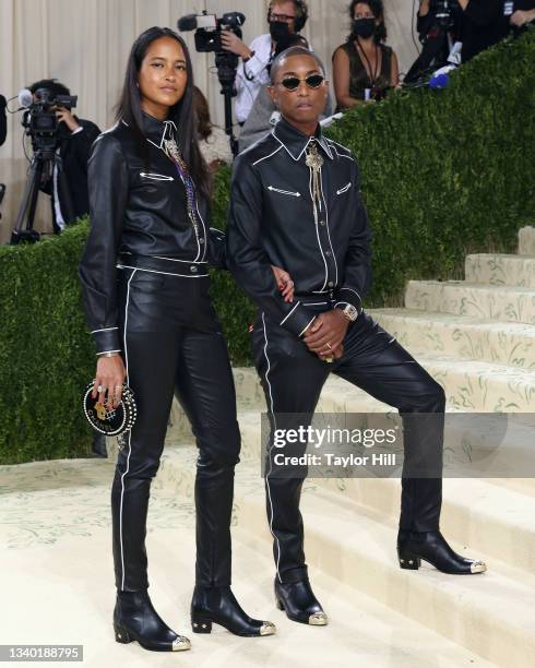 Helen Lasichanh and Pharrell Williams attend the 2021 Met Gala benefit "In America: A Lexicon of Fashion" at Metropolitan Museum of Art on September...