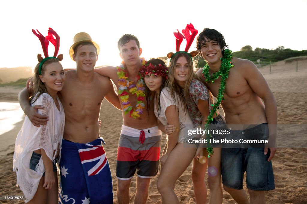 Group of teenagers on the beach at Christmas