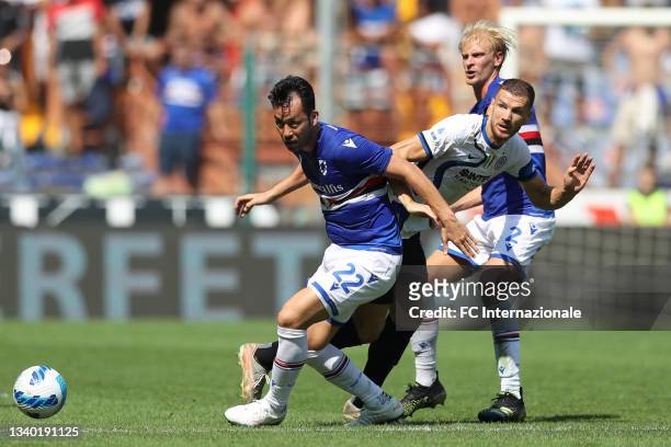 Morten Thorsby of UC Sampdoria looks on as Edin Dzeko of FC Internazionale threads the ball past Maya Yoshida of UC Sampdoria during the Serie A...