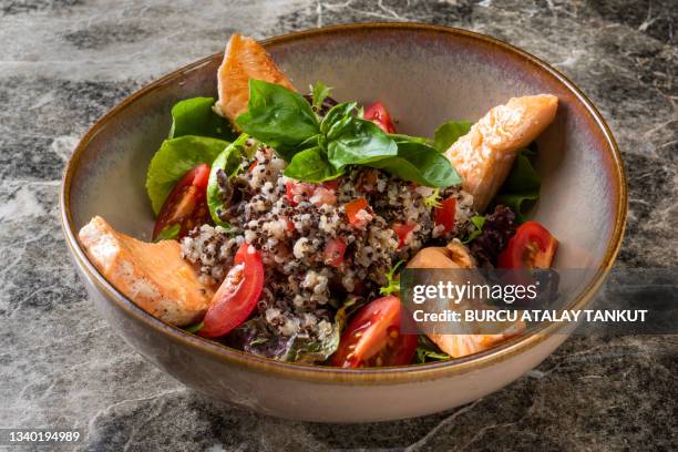 salad bowl with salmon and quinoa - quinoa stock pictures, royalty-free photos & images