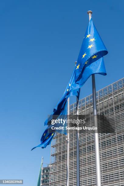 european union flags at berlaymont building of the european commission - berlaymont stock pictures, royalty-free photos & images