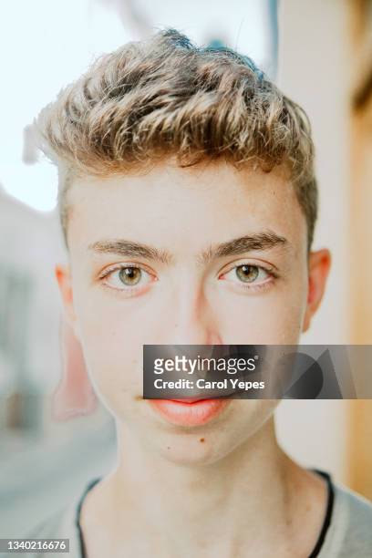close up  portrait of a teenager boy looking at camera.serious - spain teen face bildbanksfoton och bilder