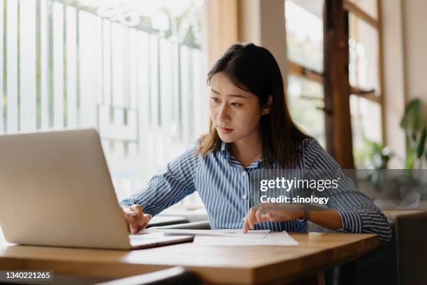 asian girl using work in cafe - girl in office stock pictures, royalty-free photos & images