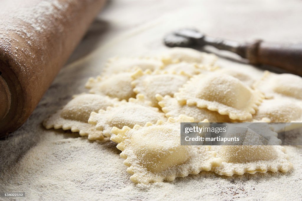 Close up of homemade ravioli and tools